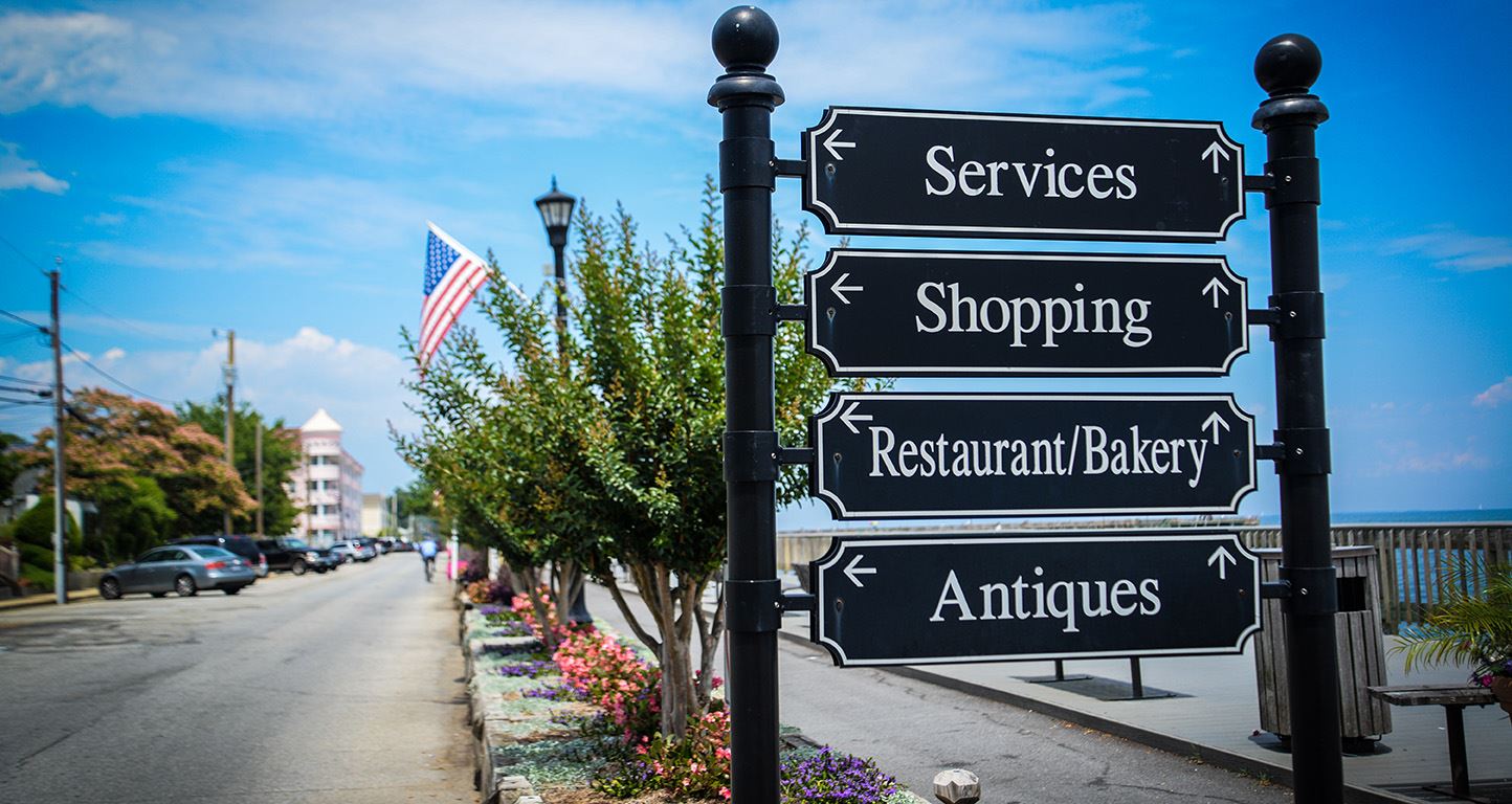 Store directional signs at North Beach taken by Angel Beil