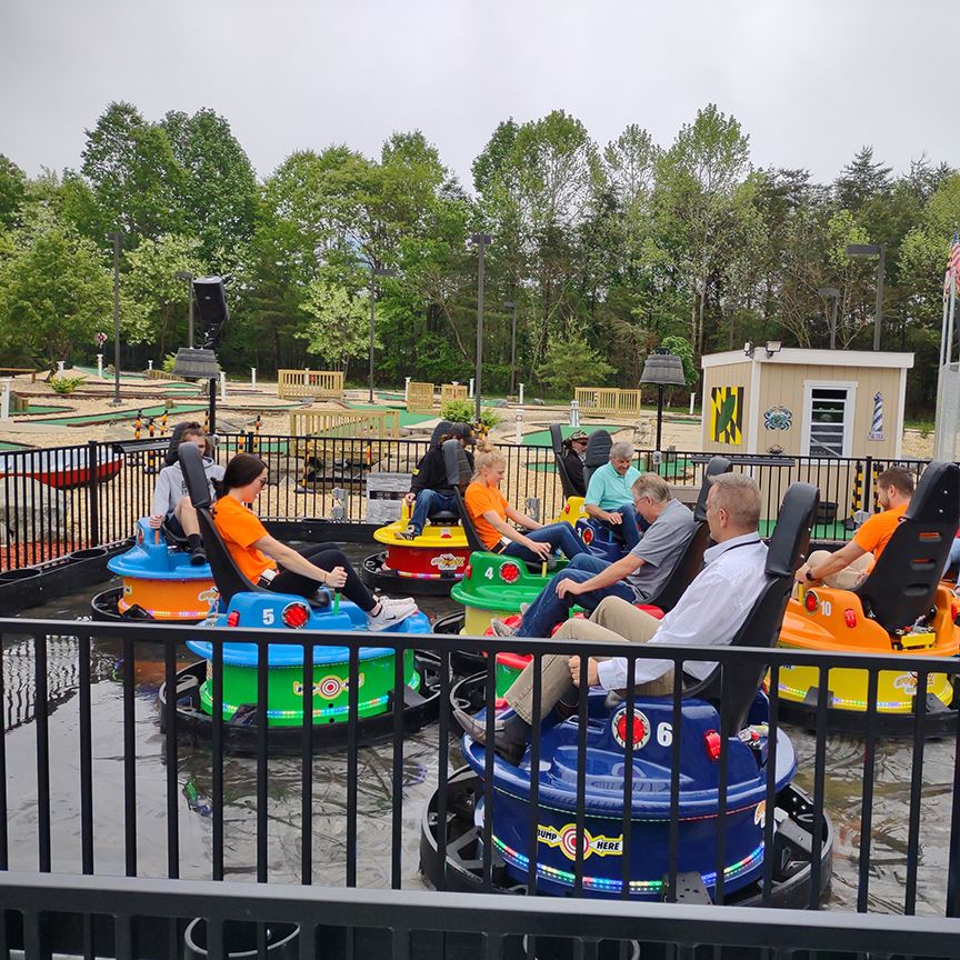 People riding on water bumper cars