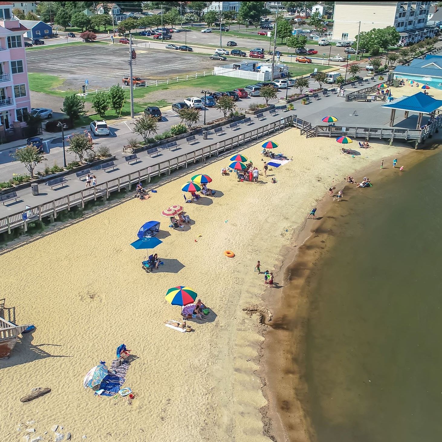Aerial photo of beach by the water and a boardwalk