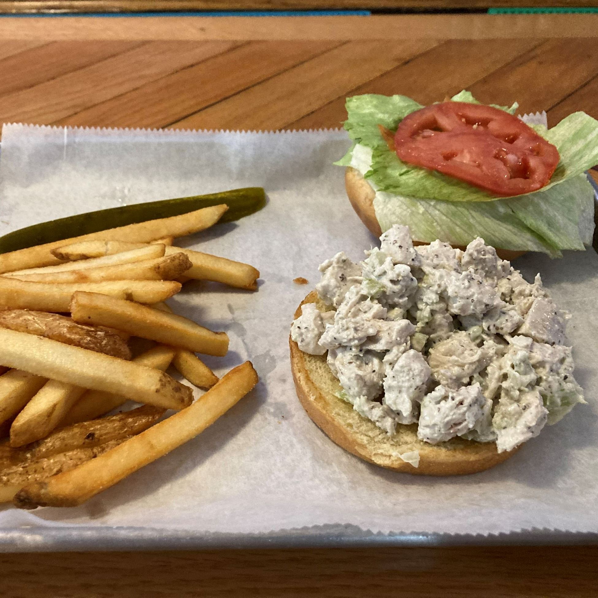 chicken salad sandwich and fries on a platter