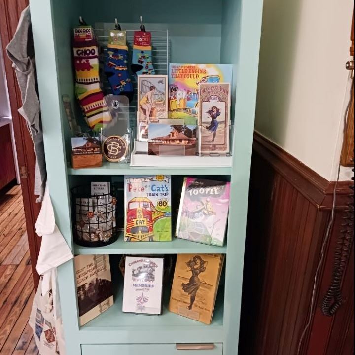 blue wooden cabinet with novelty items for sale